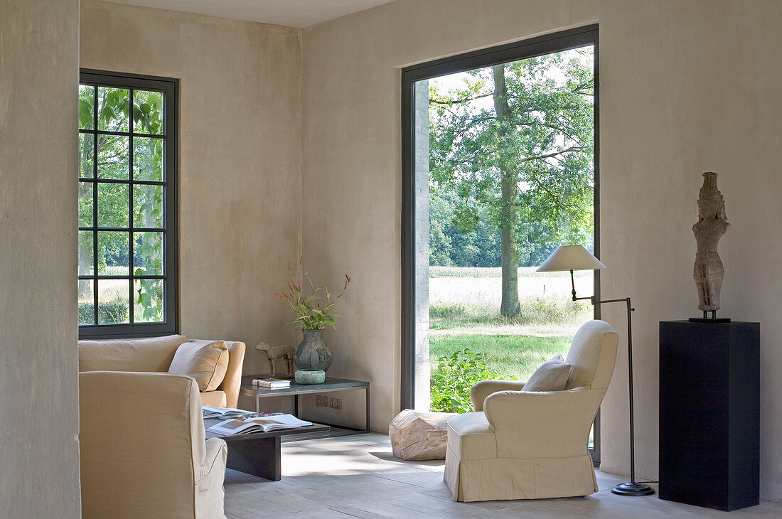 Simple living room with access to garden in country house