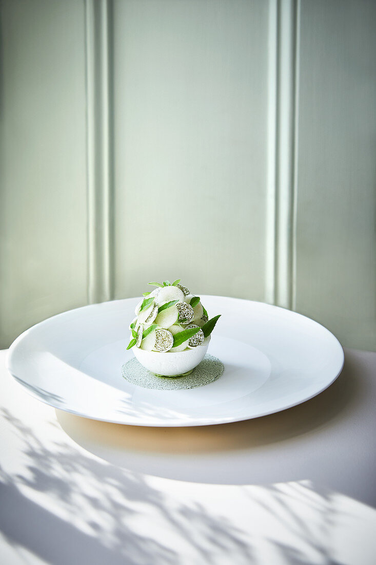William's pear sorbet in a meringue ball with peach and verbena