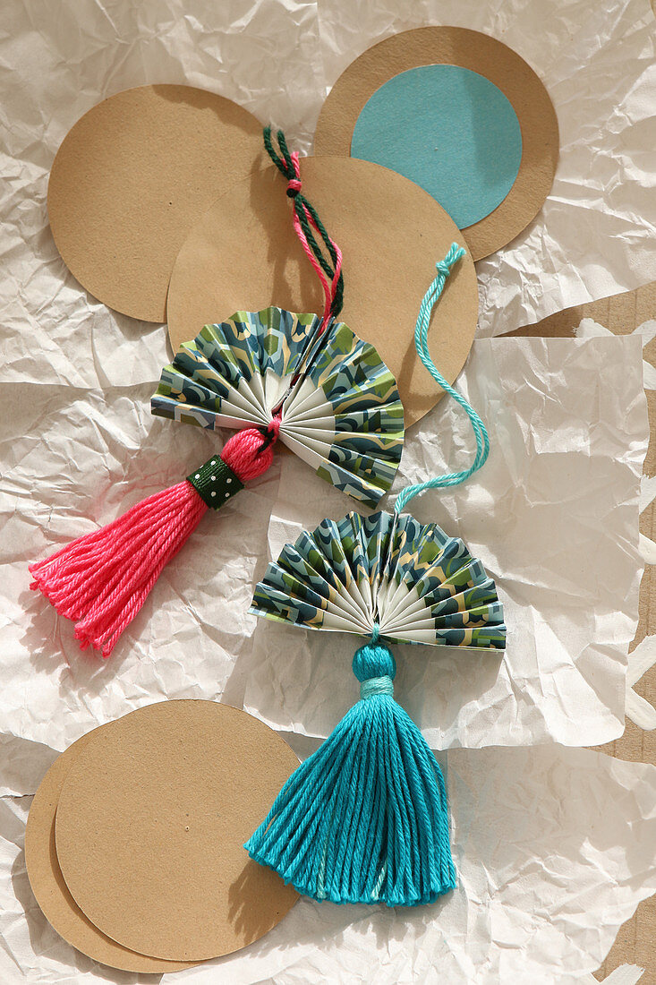 Homemade fans with tassels as decorations