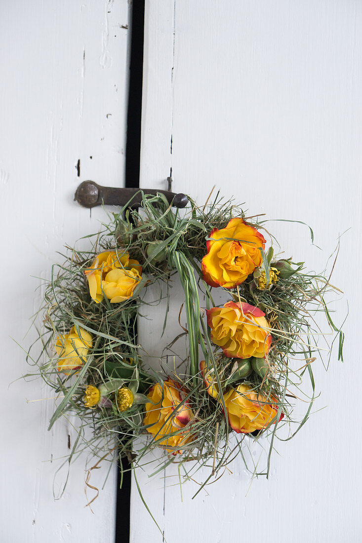 Wreath of rose flowers and grass as a door wreath