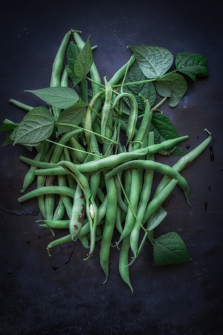 Green runner beans with leaves