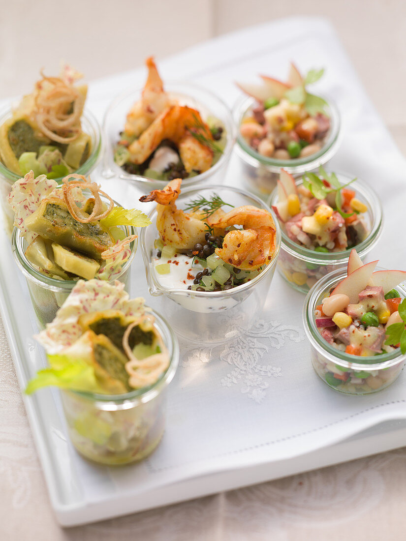 Various party salads in glasses