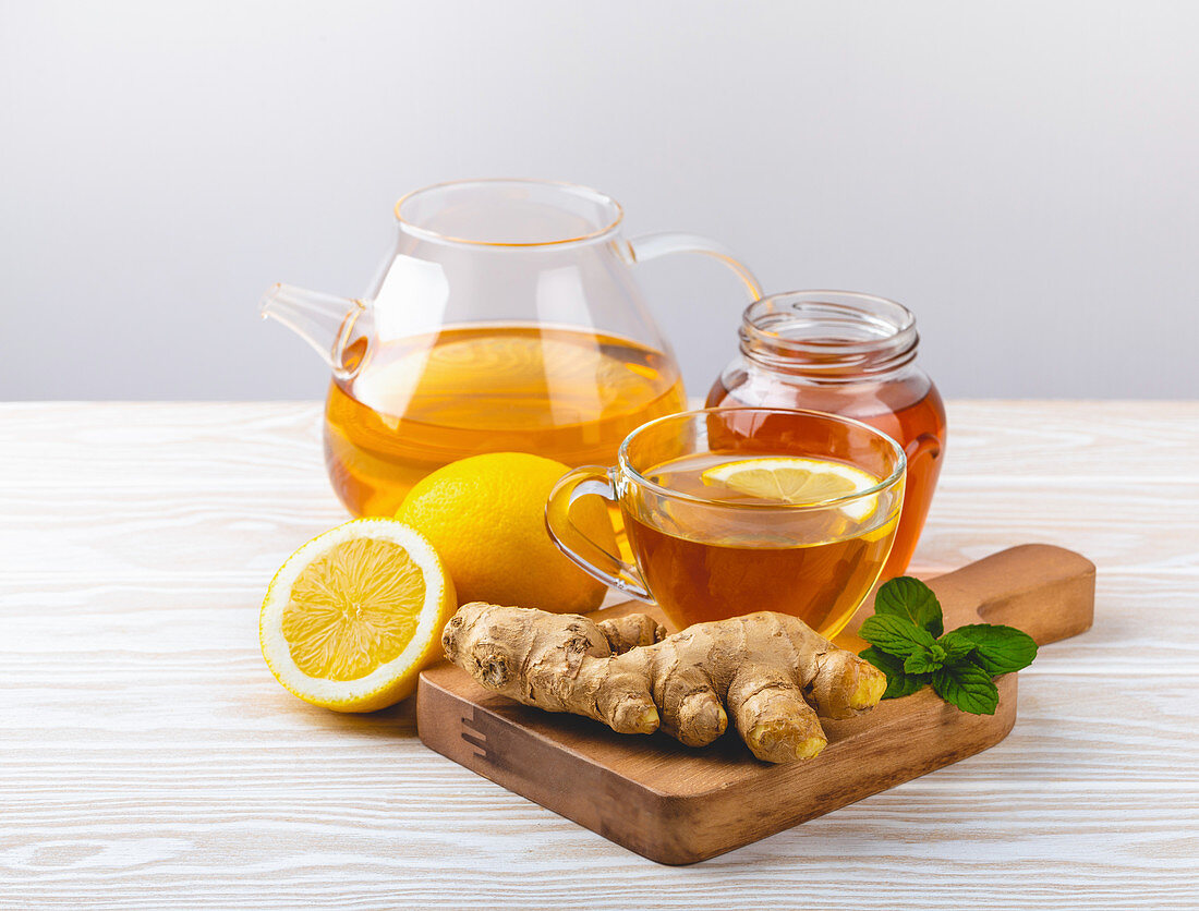 Ginger and lemon tea with fresh mint - homemade natural remedy against flu, cold and cough