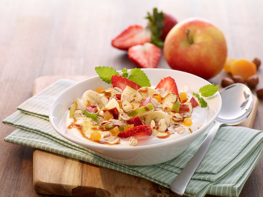 Muesli with apples, strawberries and hazelnuts