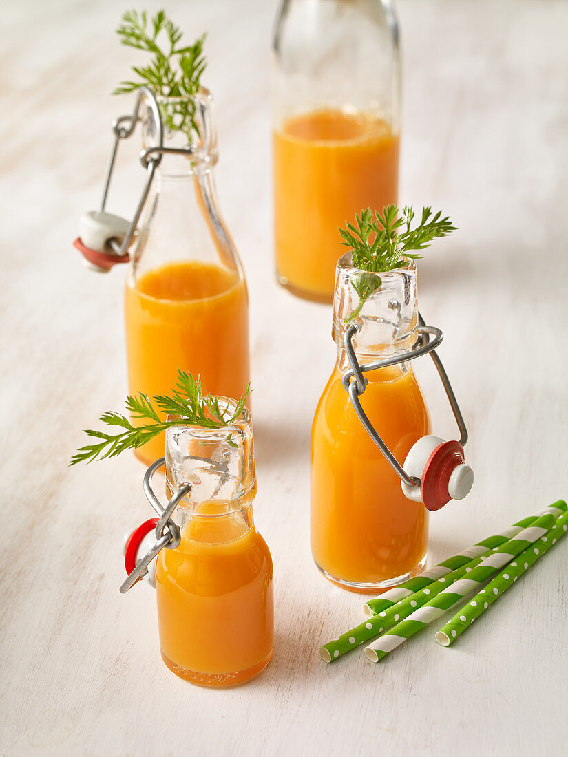 Carrot juice in flip-top jars
