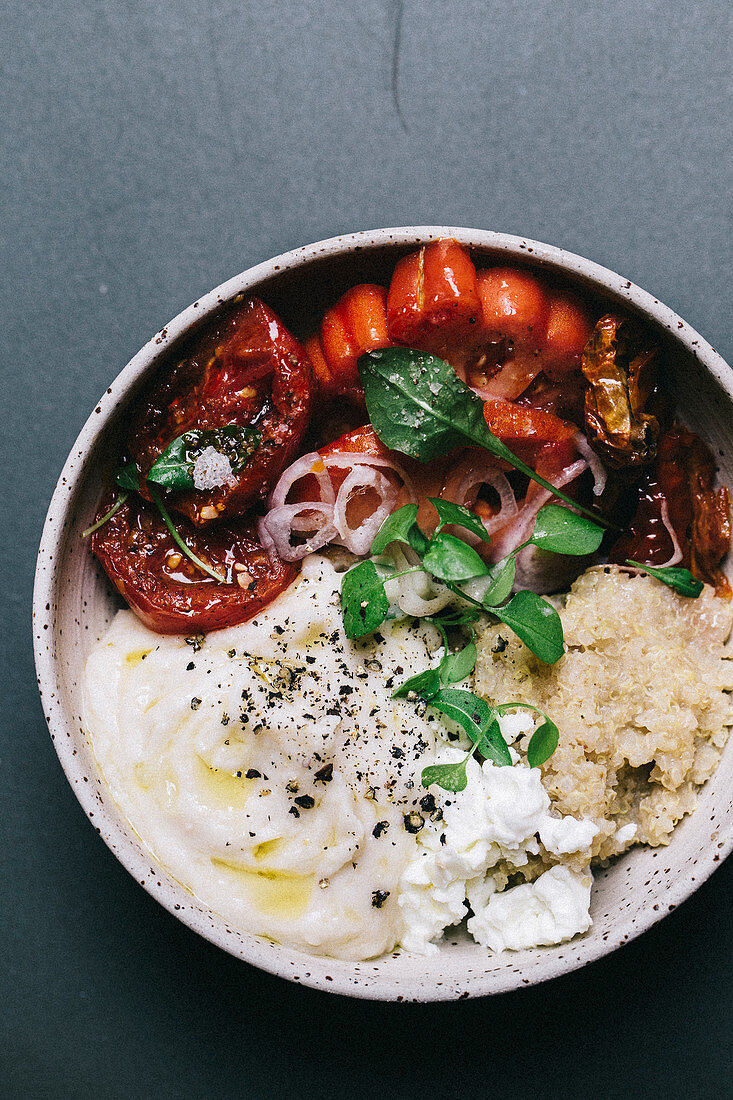 A quick quinoa bowl with bean cream and tomatoes