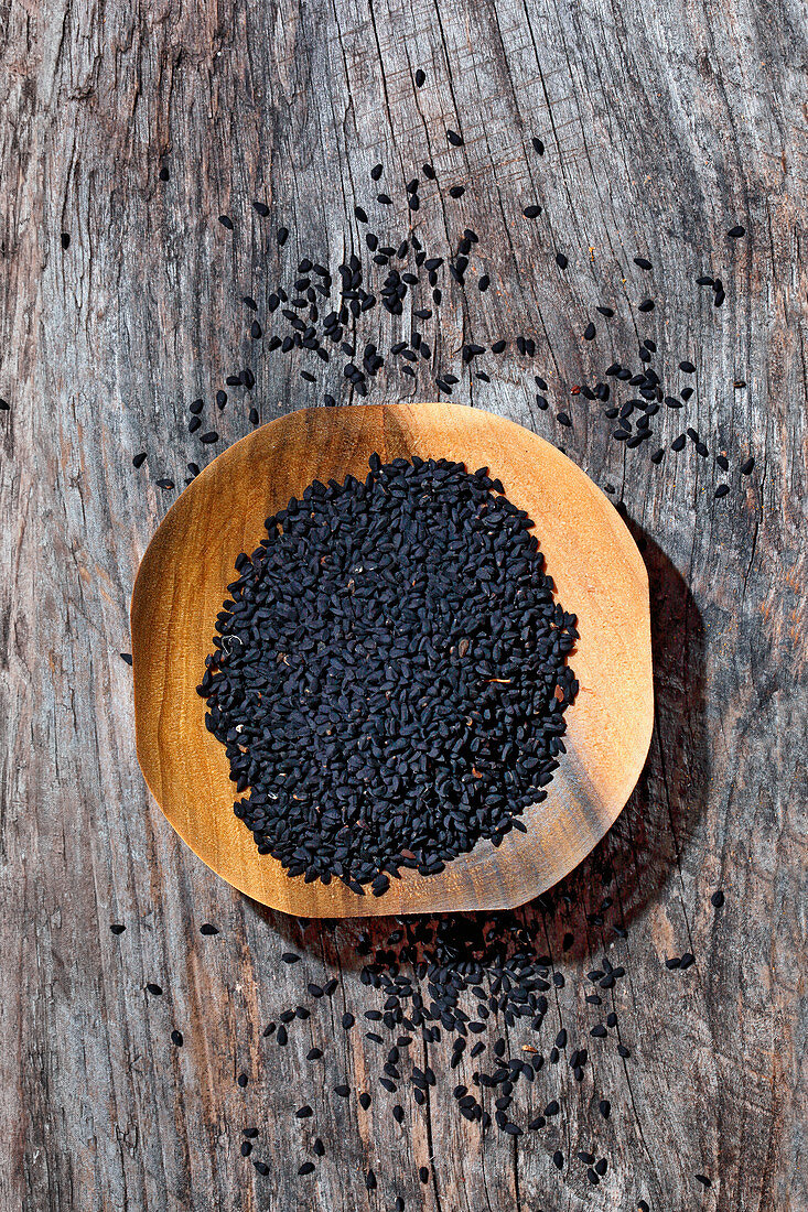 Black caraway in a wooden bowl