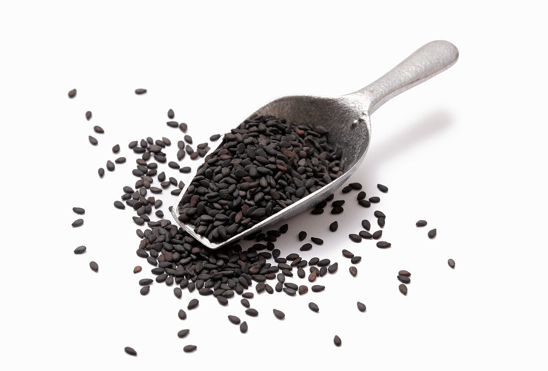 Black sesame seeds in a metal scoop