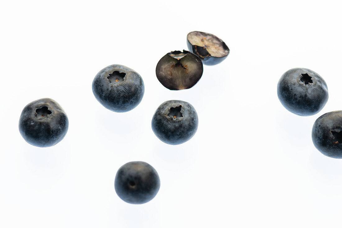 Fresh blueberries on a white surface