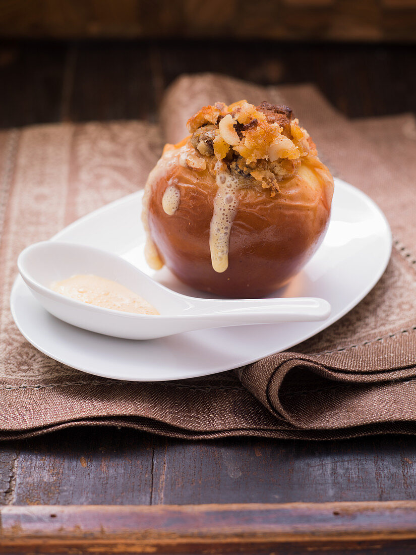 A baked apple with vanilla froth