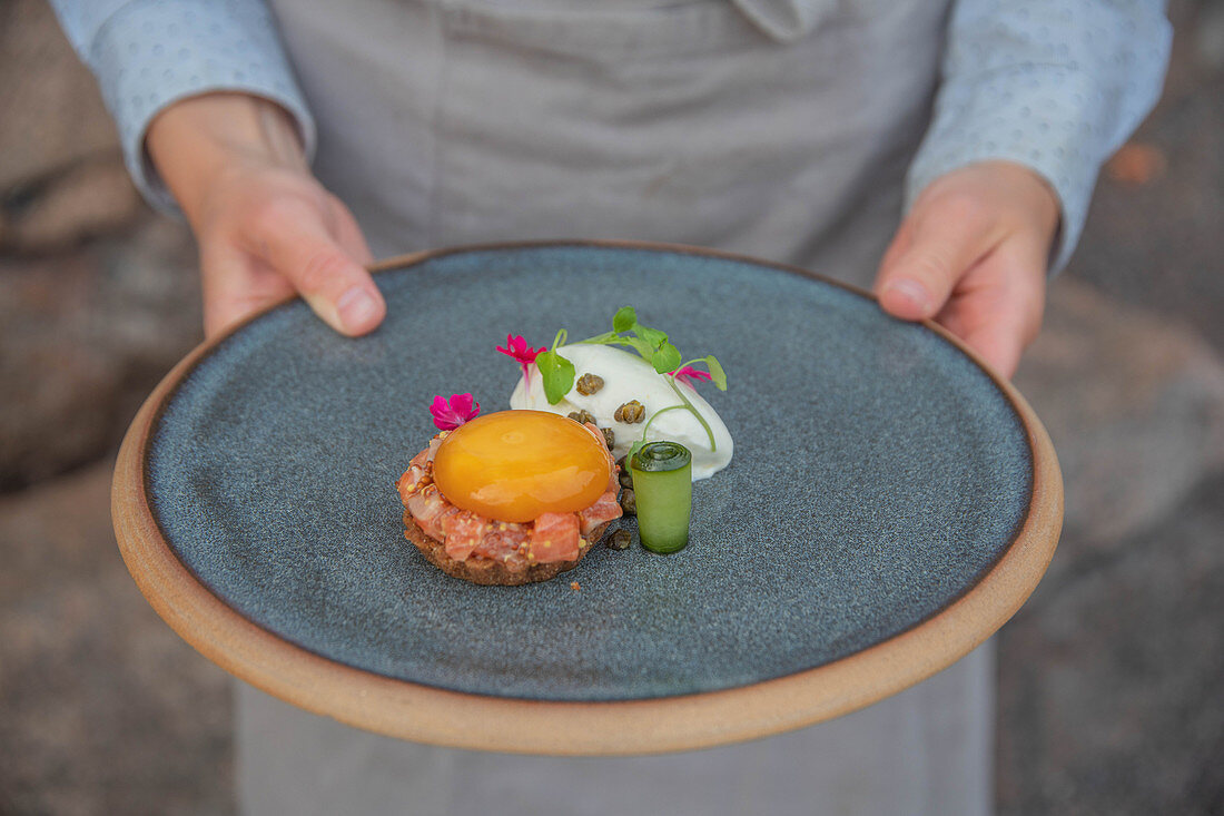 Salmon tartare with egg yolk preserved in soy sauce