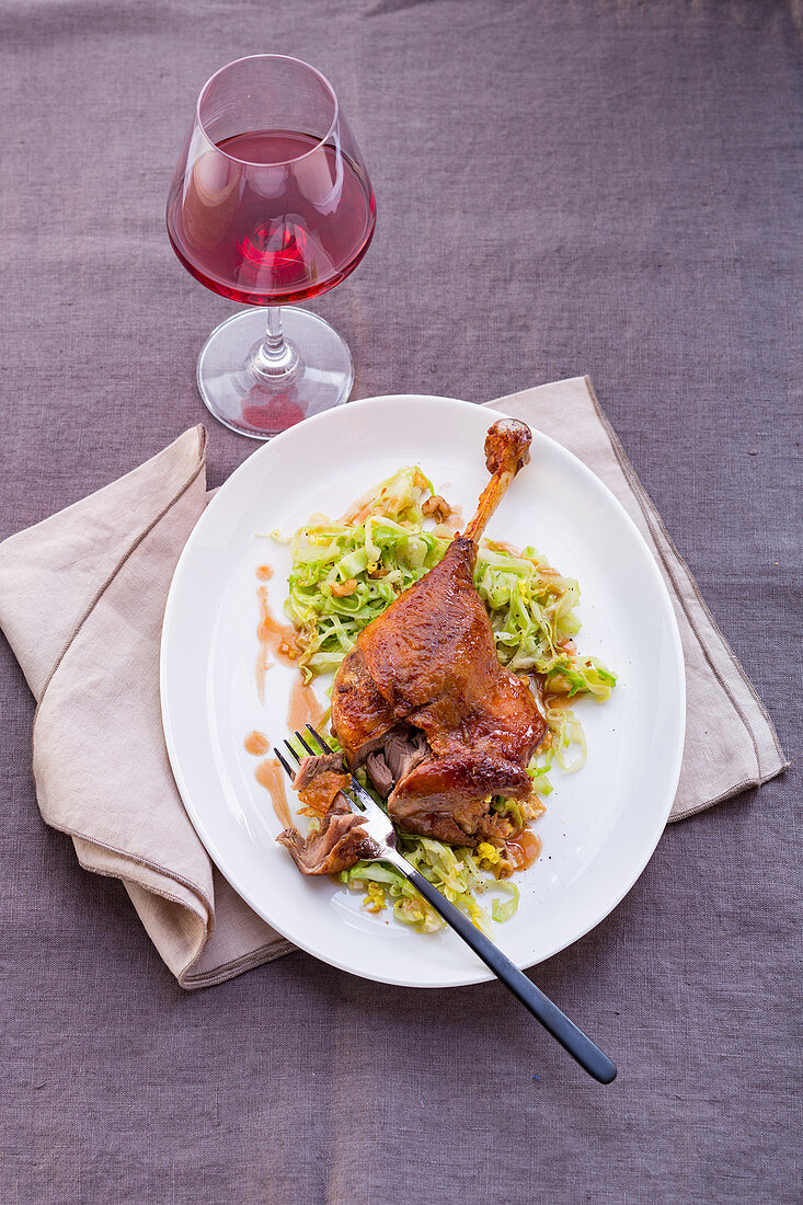 Goose leg with pointed cabbage and nuts