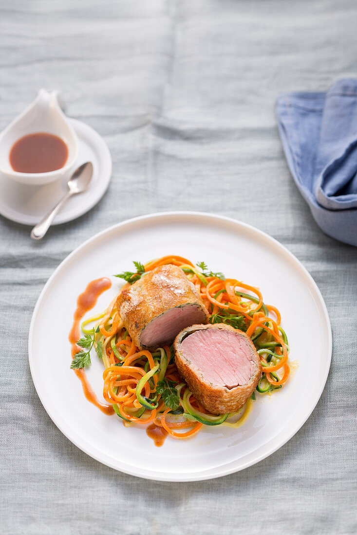 Pork fillet wrapped in pastry with vegetable spirals