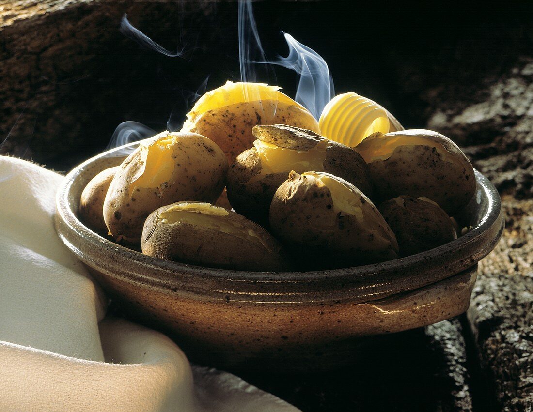 Steaming Potatoes in a Bowl; Butter Curl