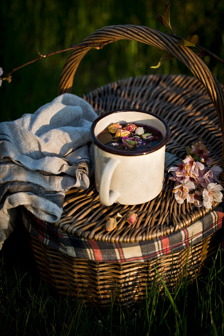 Cup of tea and picnic basket