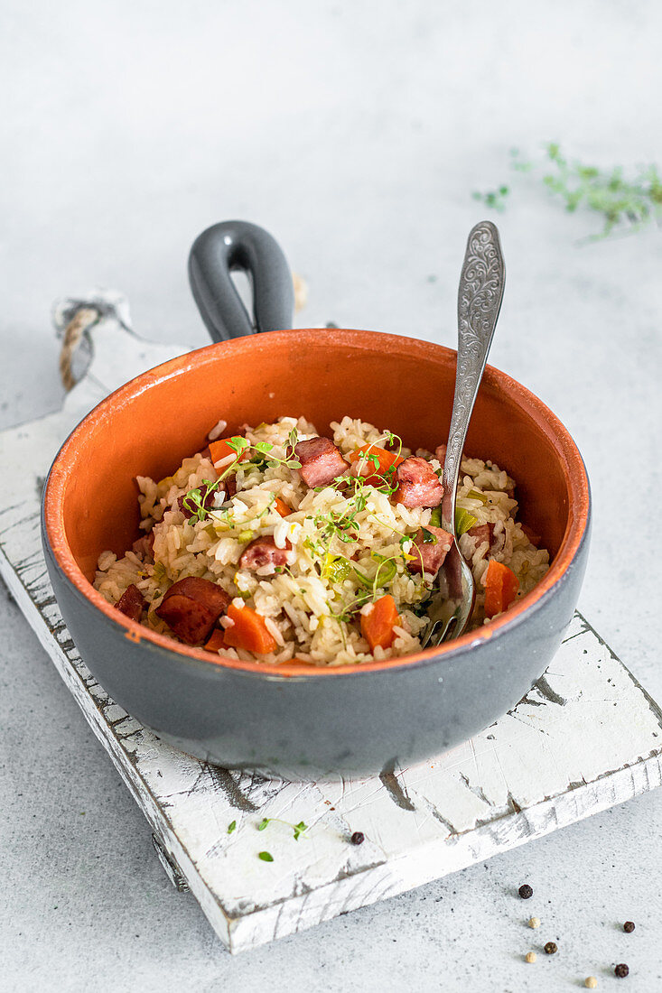 Rice dish with sausage and carrots