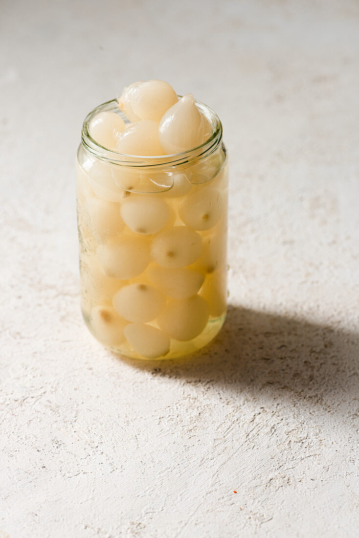 Pickled small onions in a jar