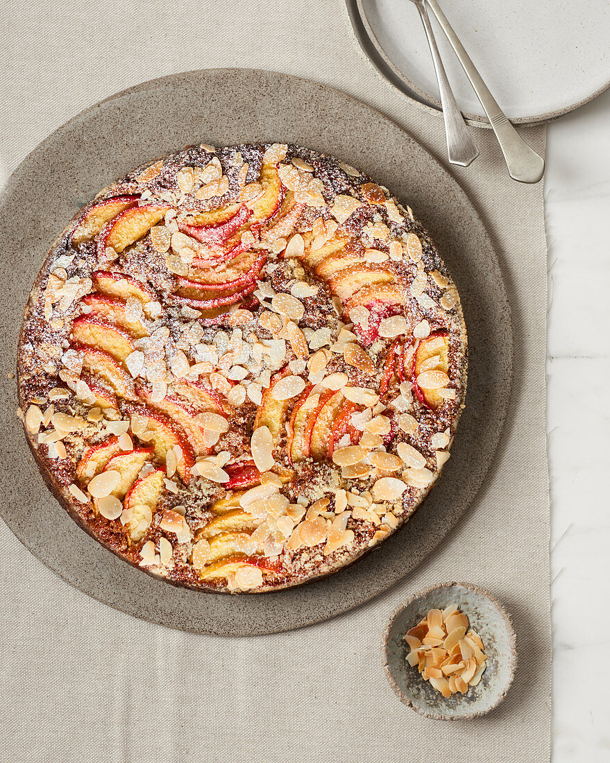 Almond and nut cake with peaches