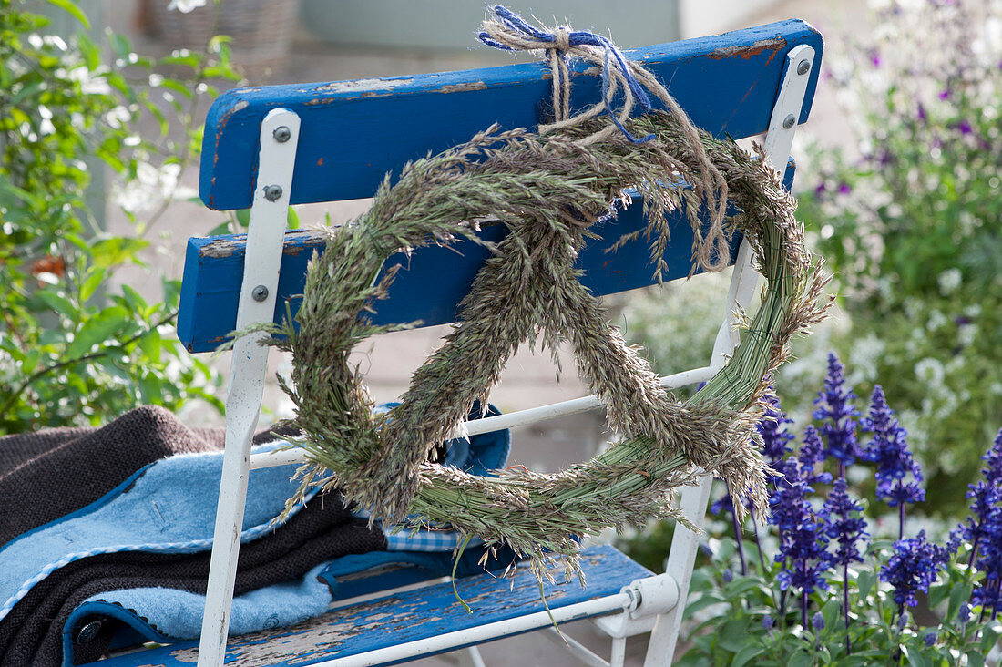 Pretzel made from grass blossoms on the back of the chair