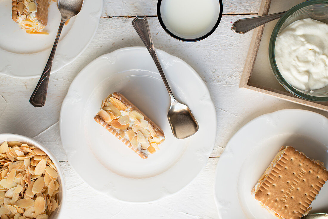 Biscuit slices with shortbread, cream and almonds