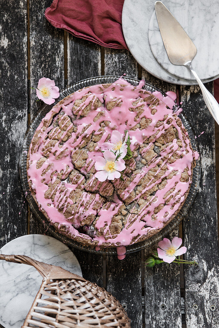 Poppy seed crumble cake with raspberry icing