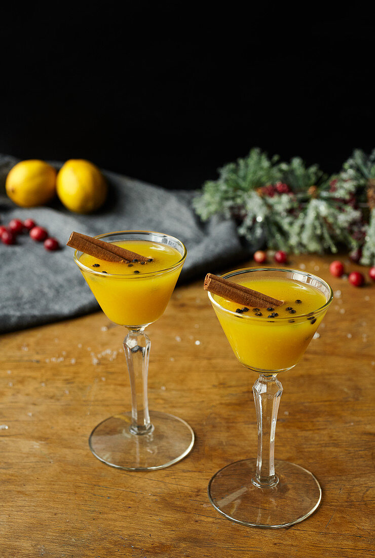 Canelazo (Equador) drink made with aguardiente, passion fruit, cinnamon, and lemon