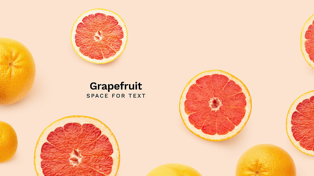Creative banner flatlay with fresh grapefruits isolated on pink background