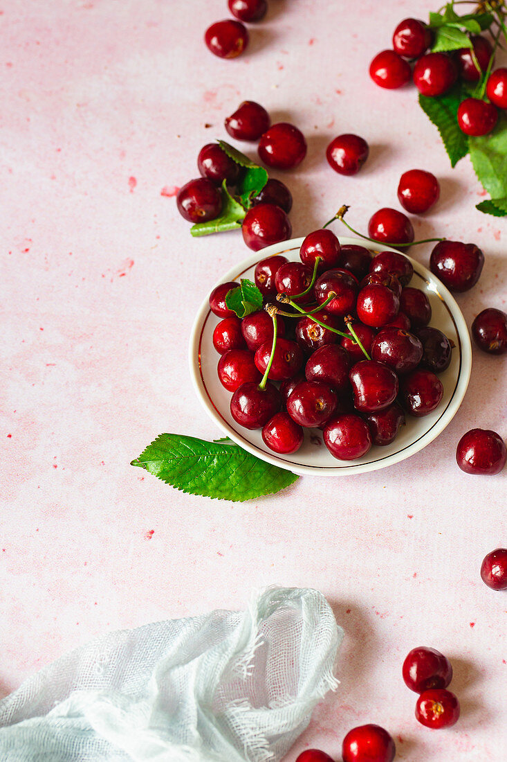 Organic cherries on pink background