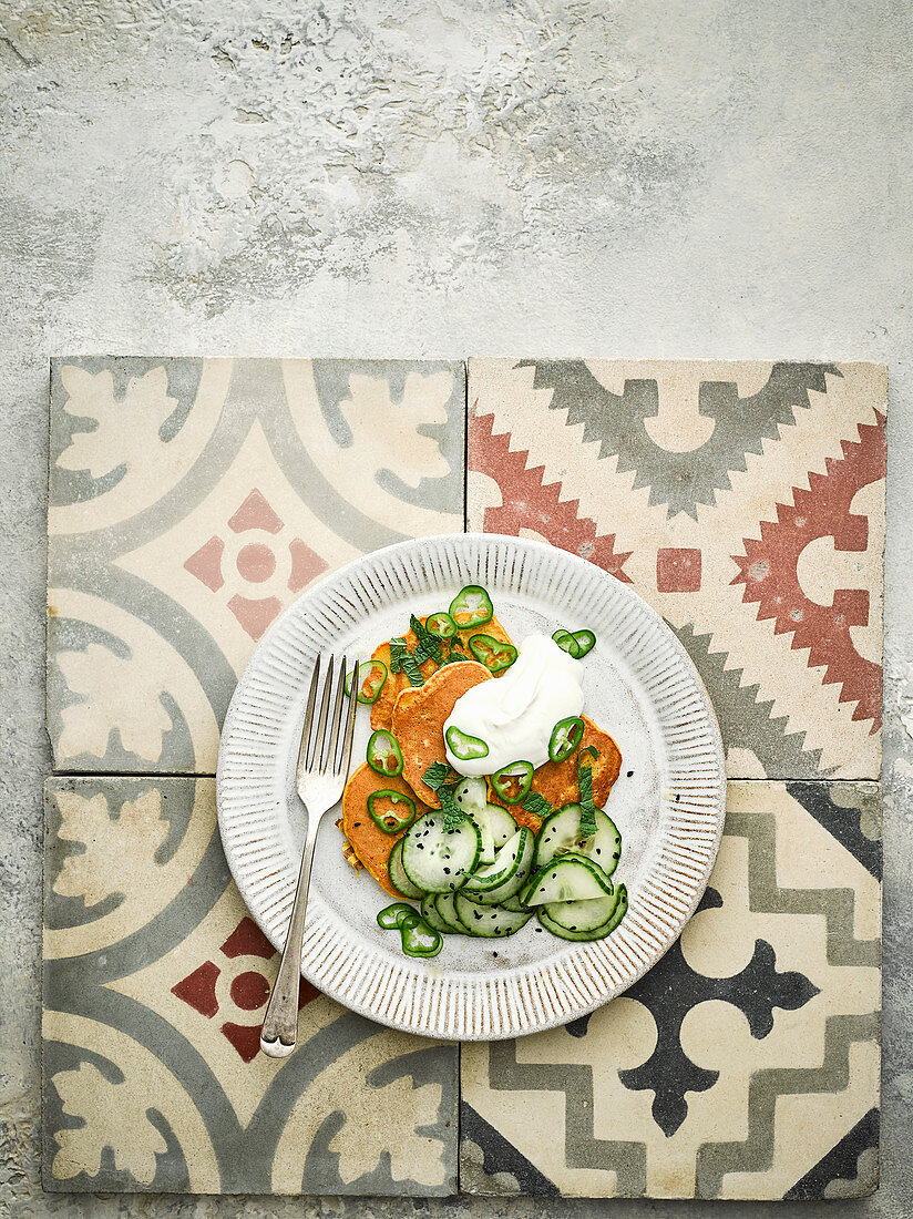 Chickpea fritters with yogurt, green chilli and cucumber salad