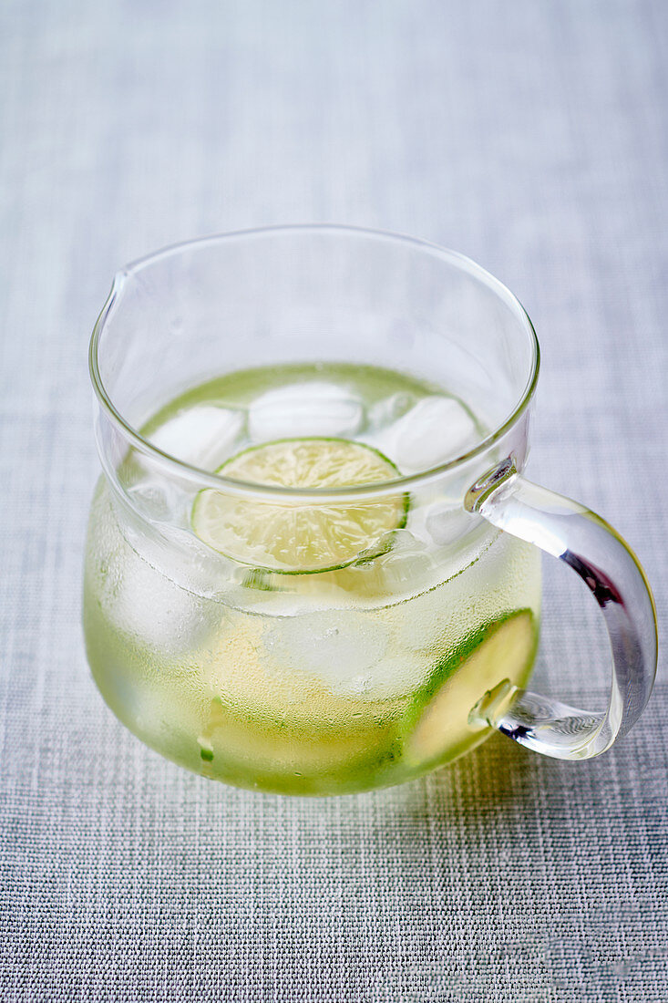 Water with lime slices and ice cubes