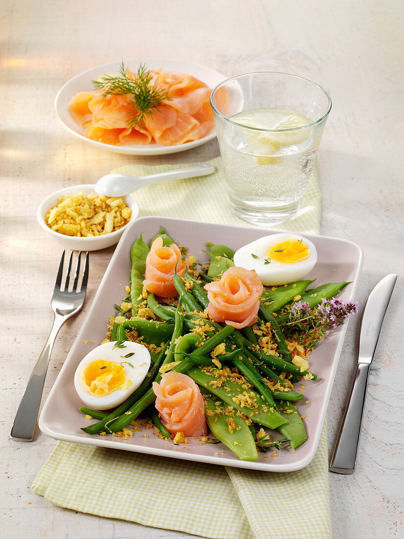 A platter of beans with smoked salmon and boiled eggs