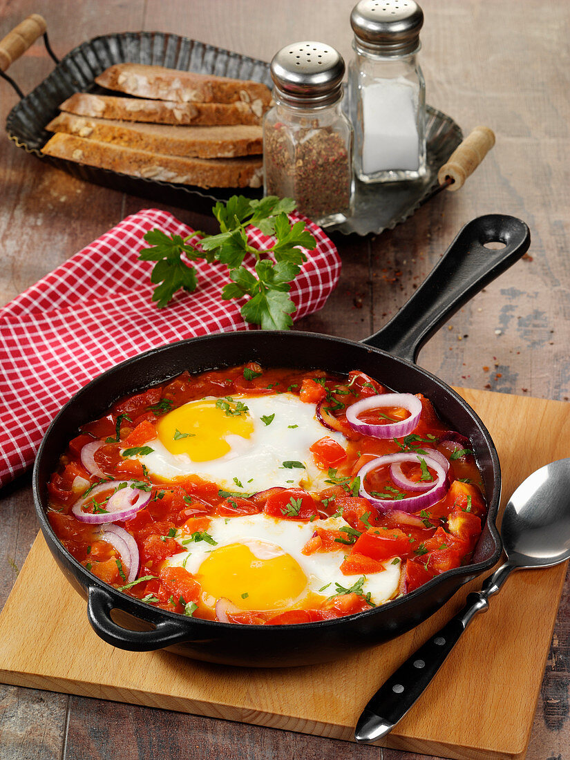 Quick fried tomatoes with fried eggs