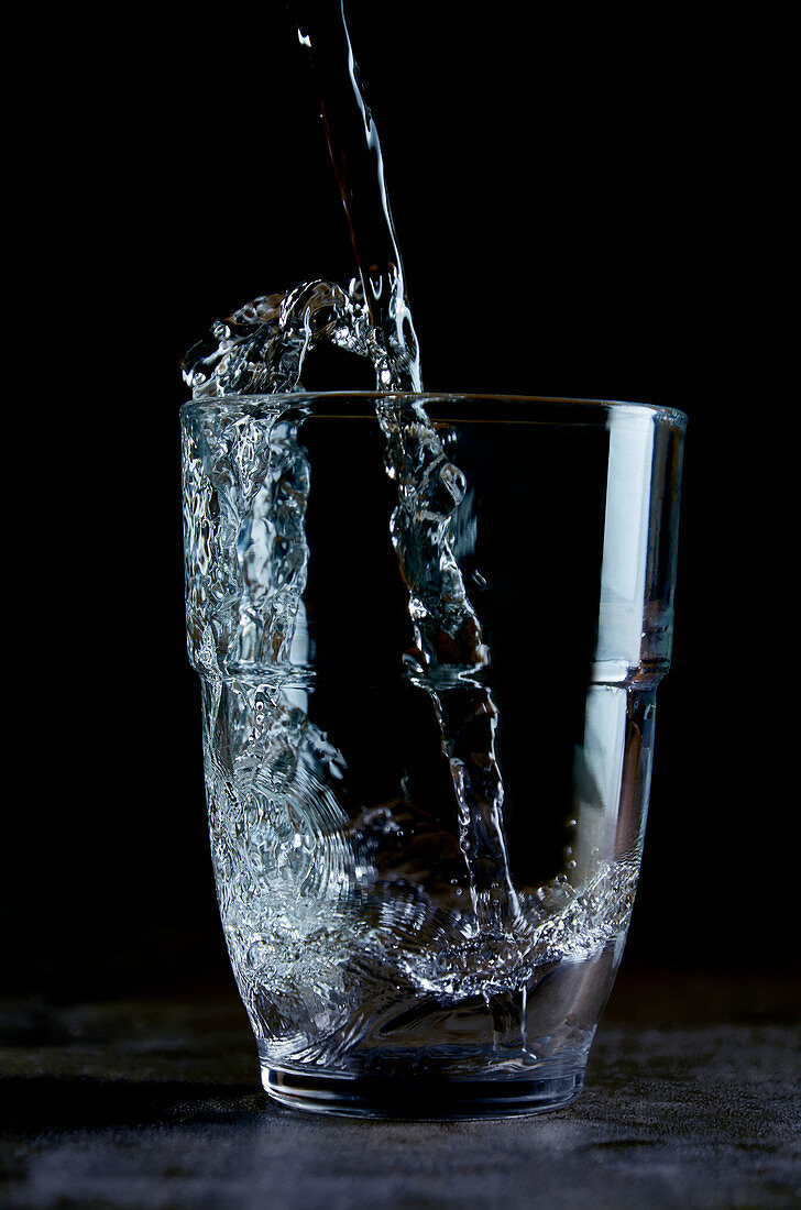 Water being poured into a glass