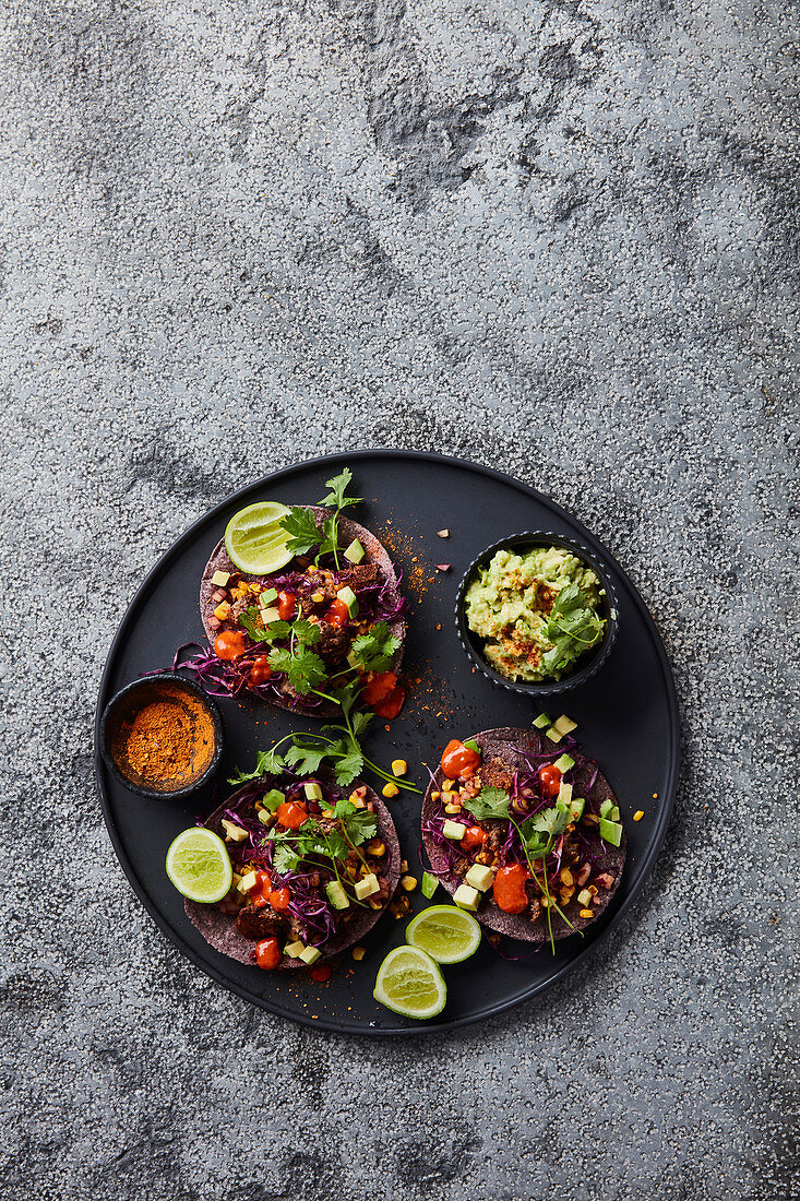 Black bean, mushroom and rye “meatball” tacos with blackened corn, avo and chipotle