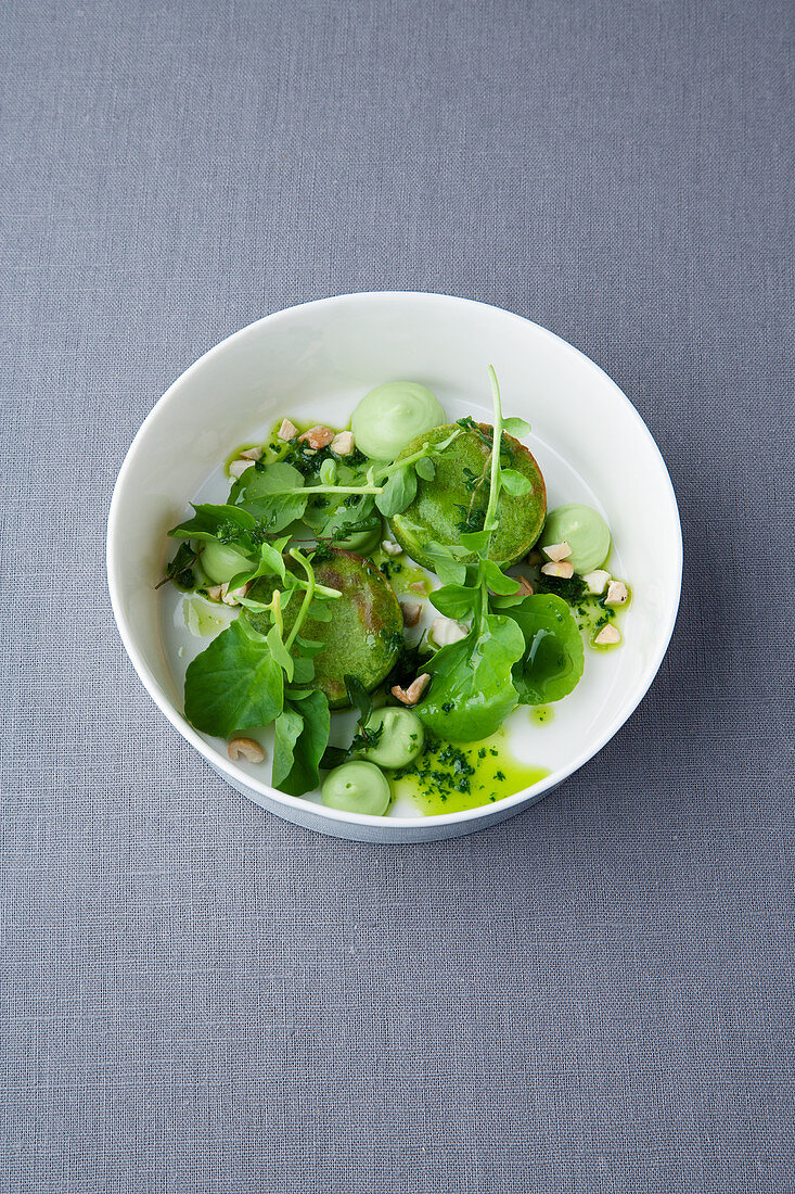 Goat’s cheese and oregano cakes with lime guacamole and watercress