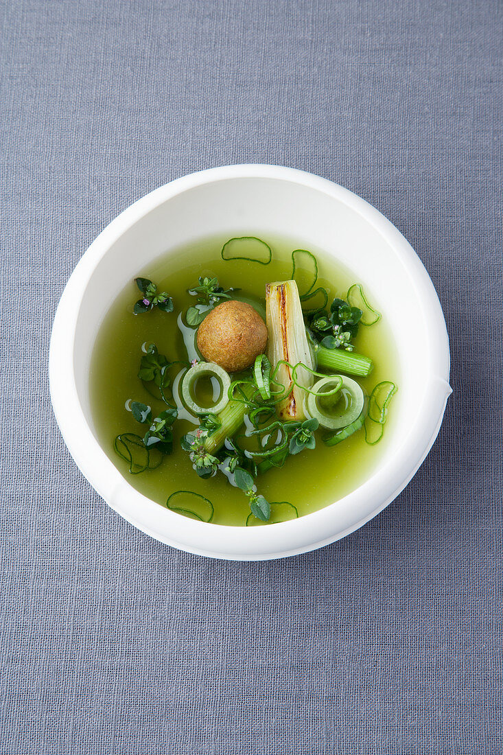 Spring onion and thyme tea with fried semolina dumplings