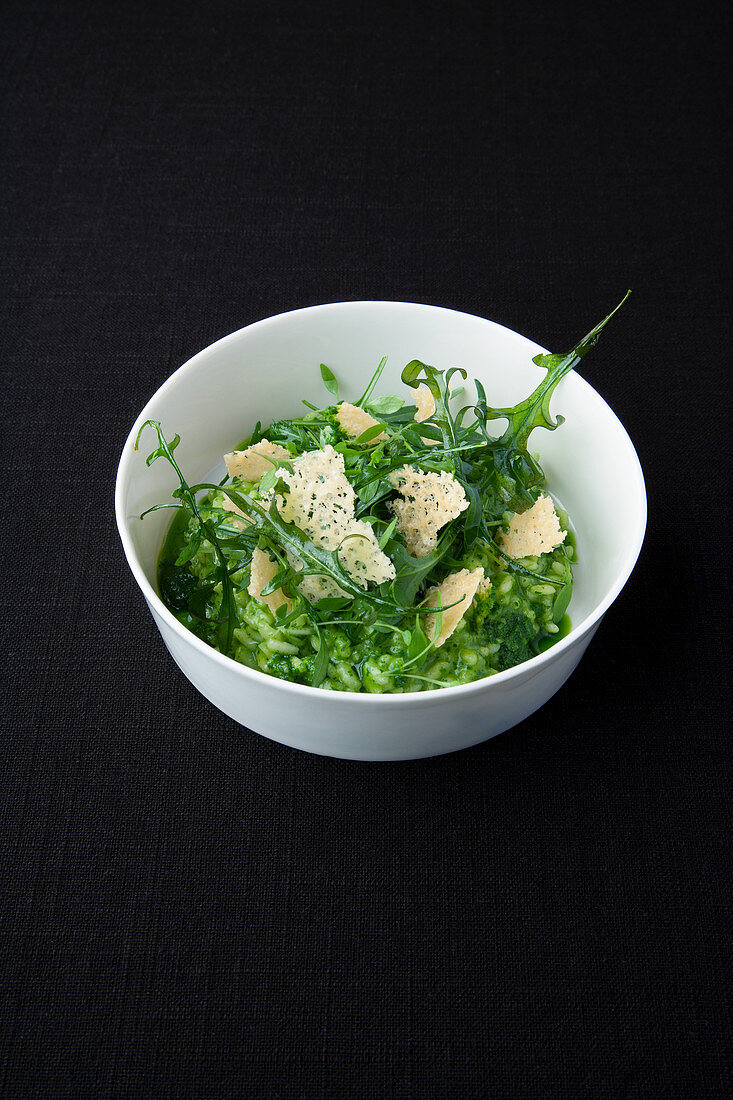 Arugula and mocha risotto with mountain cheese crunchy topping