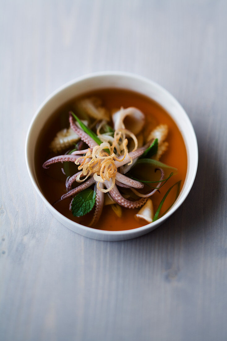 Roast squid broth with allspice and mint