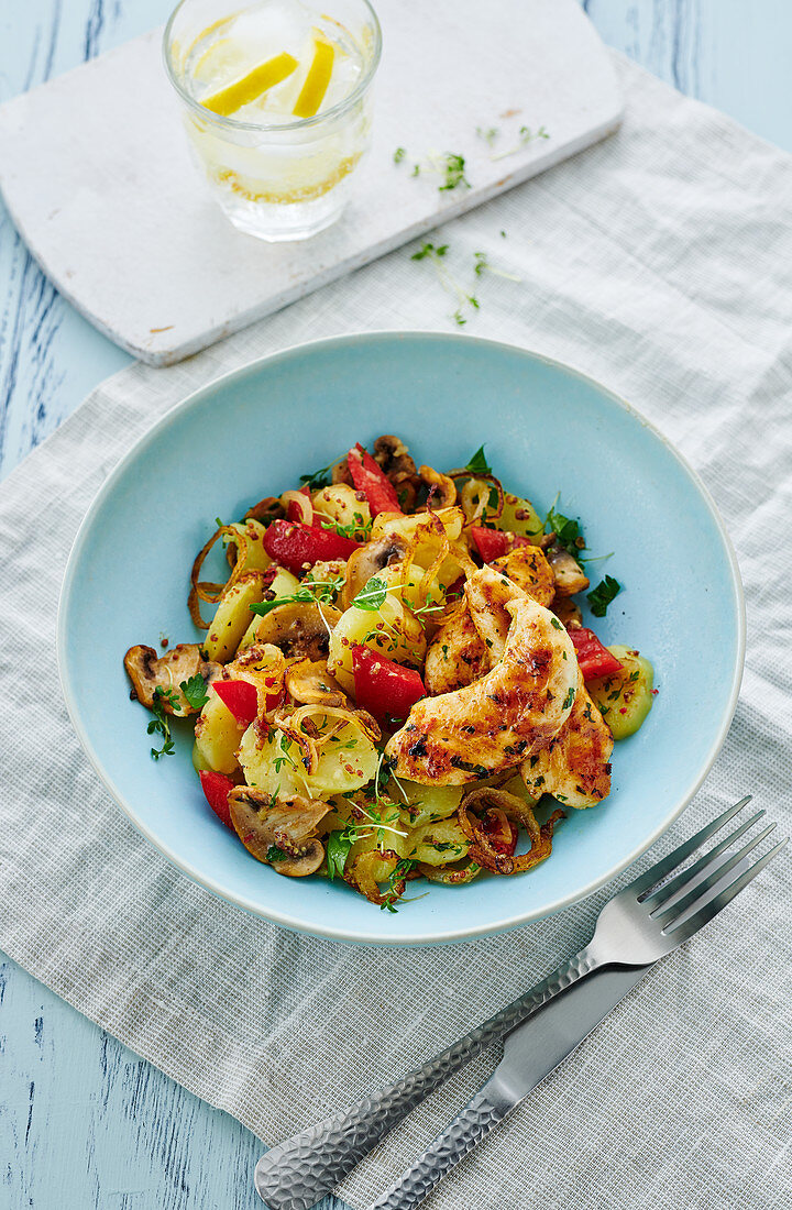 Fried potato salad with chicken fillets