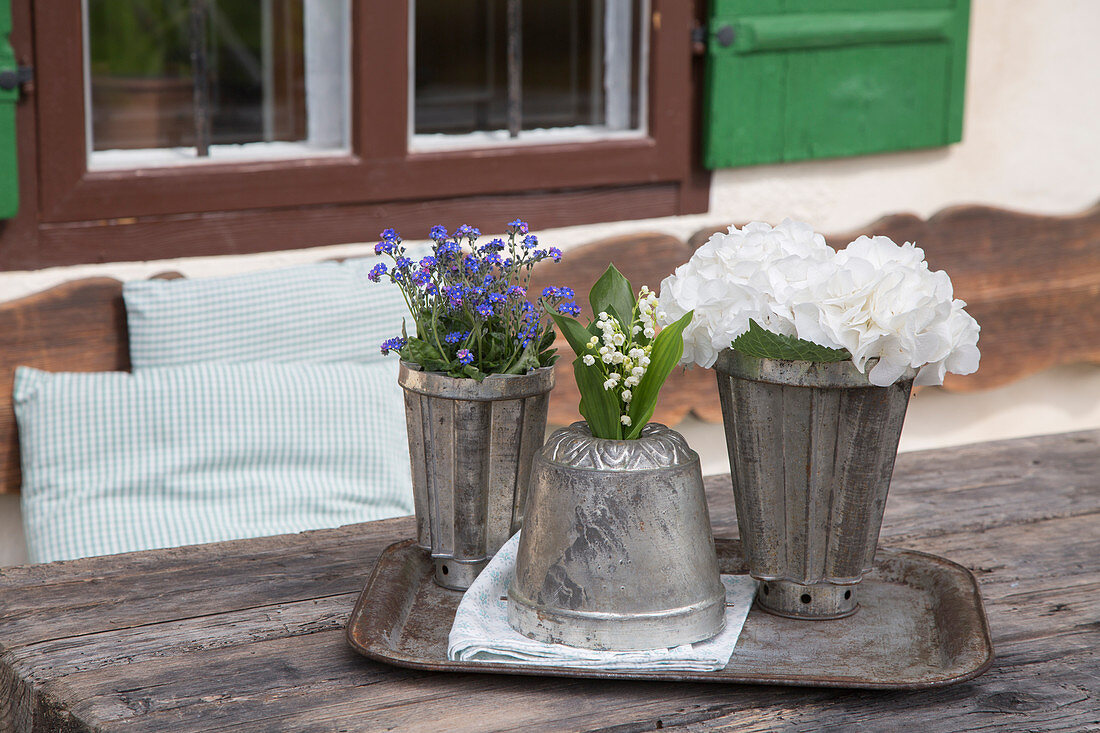 Posies of forget-me-nots, lily-of-the-valley and hydrangea