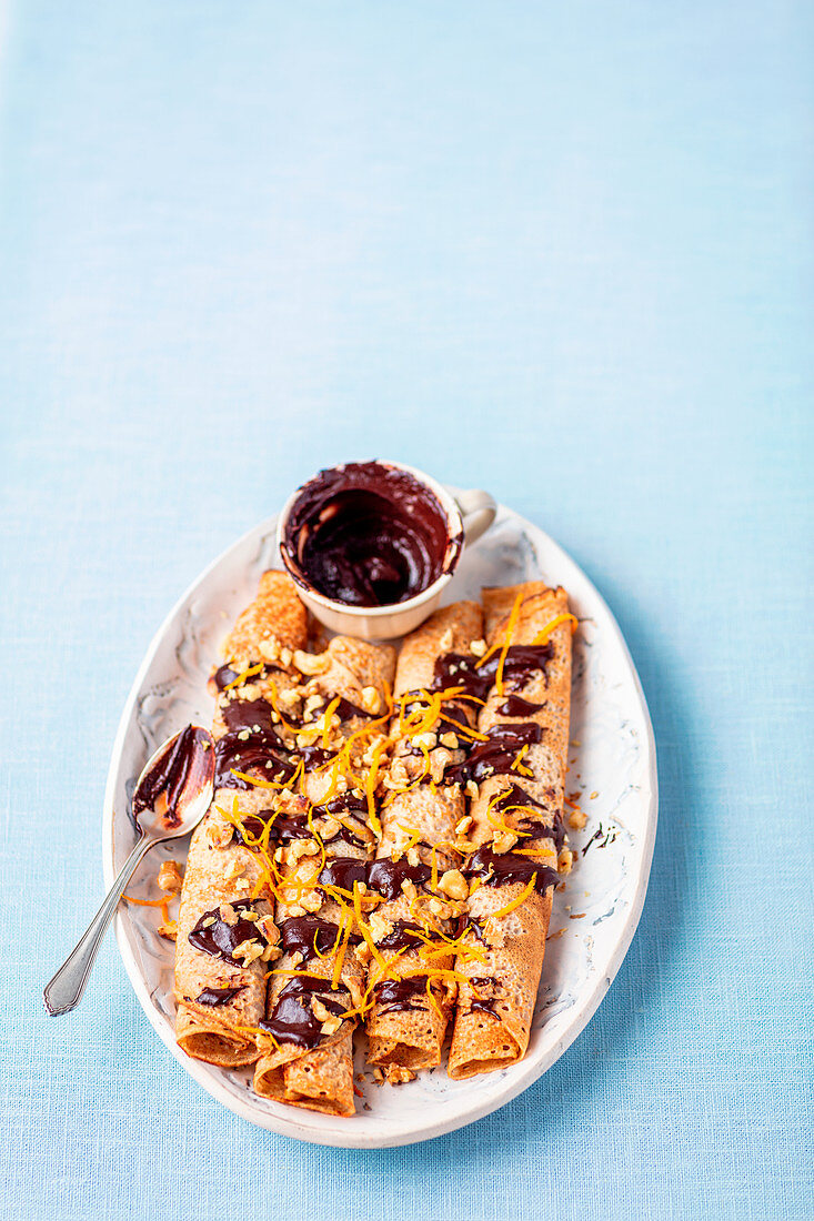 Pancakes with chocolate sauce and orange zest