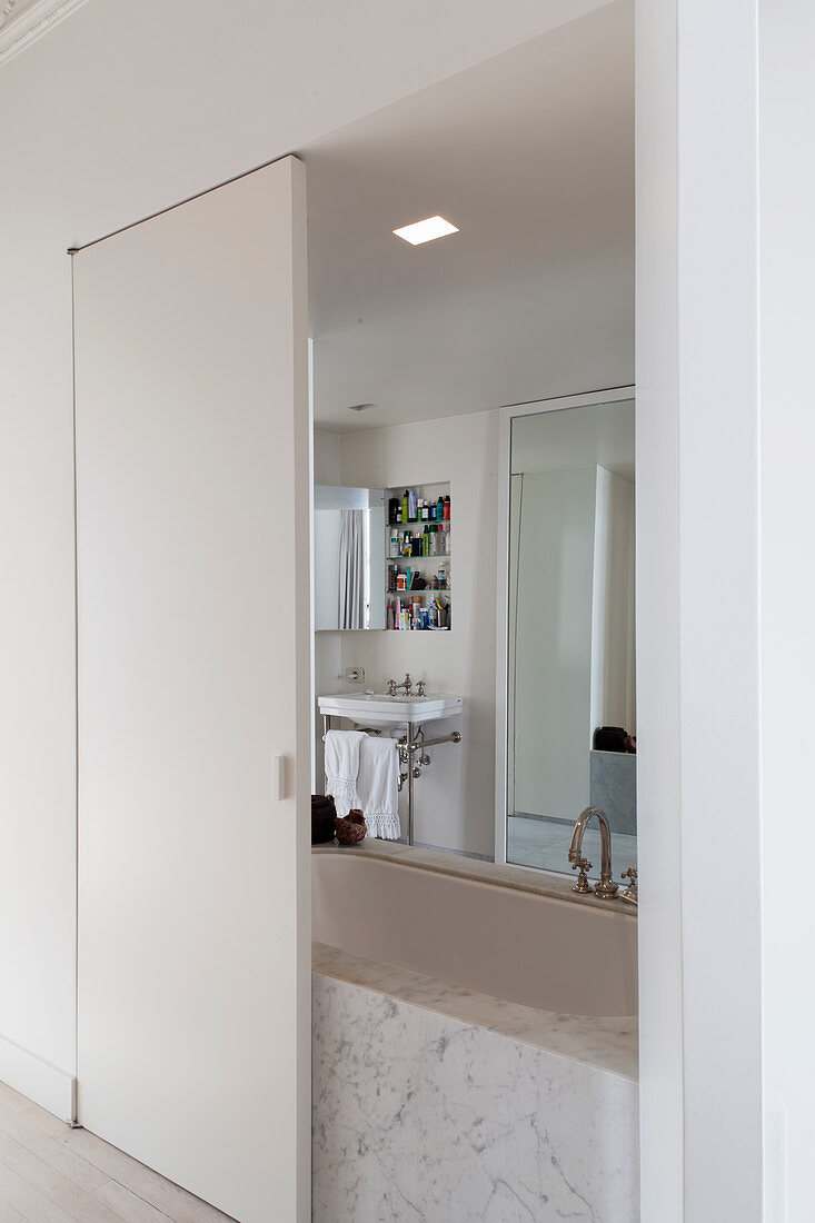 View into ensuite bathroom through open sliding door