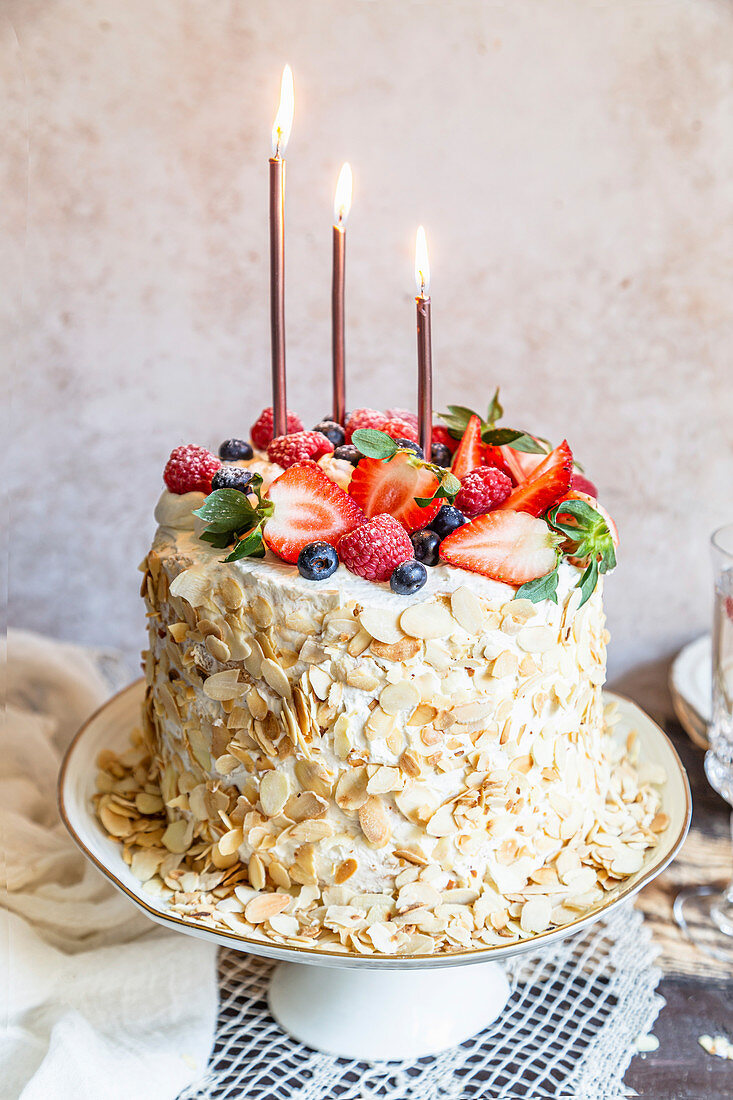 Birthday cake with mascarpone cream and berries.