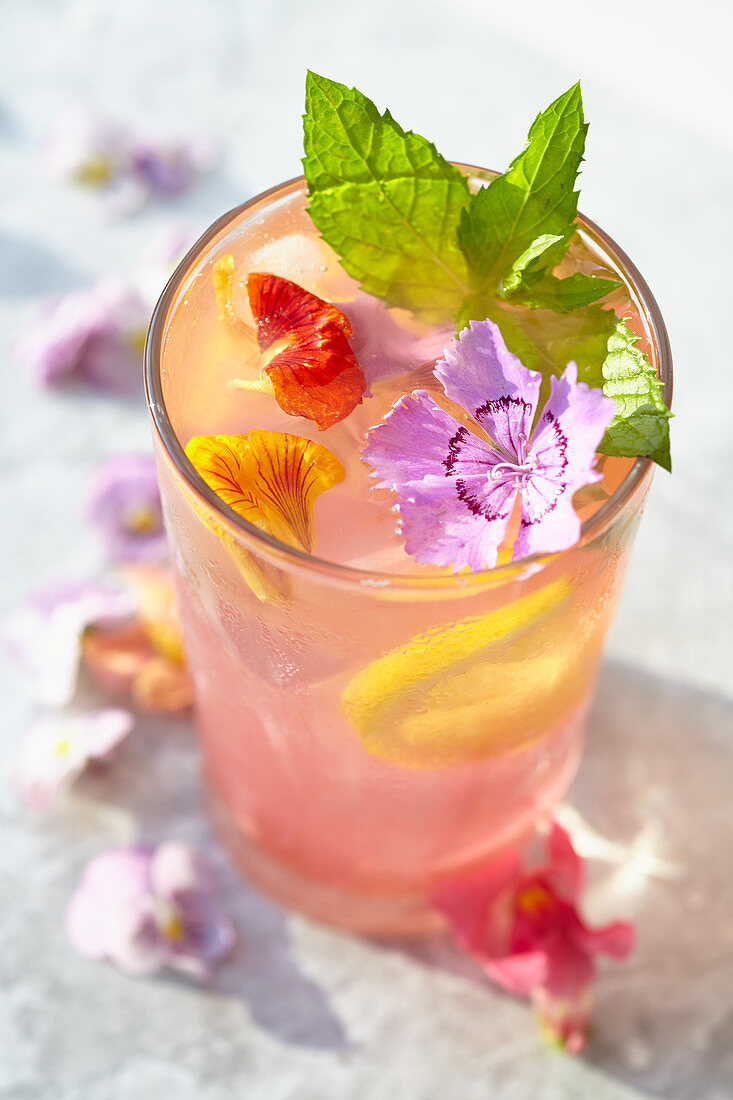 Edible flowers-Watermelon lemonade with flower ice cubes, mint and edible flower garnish