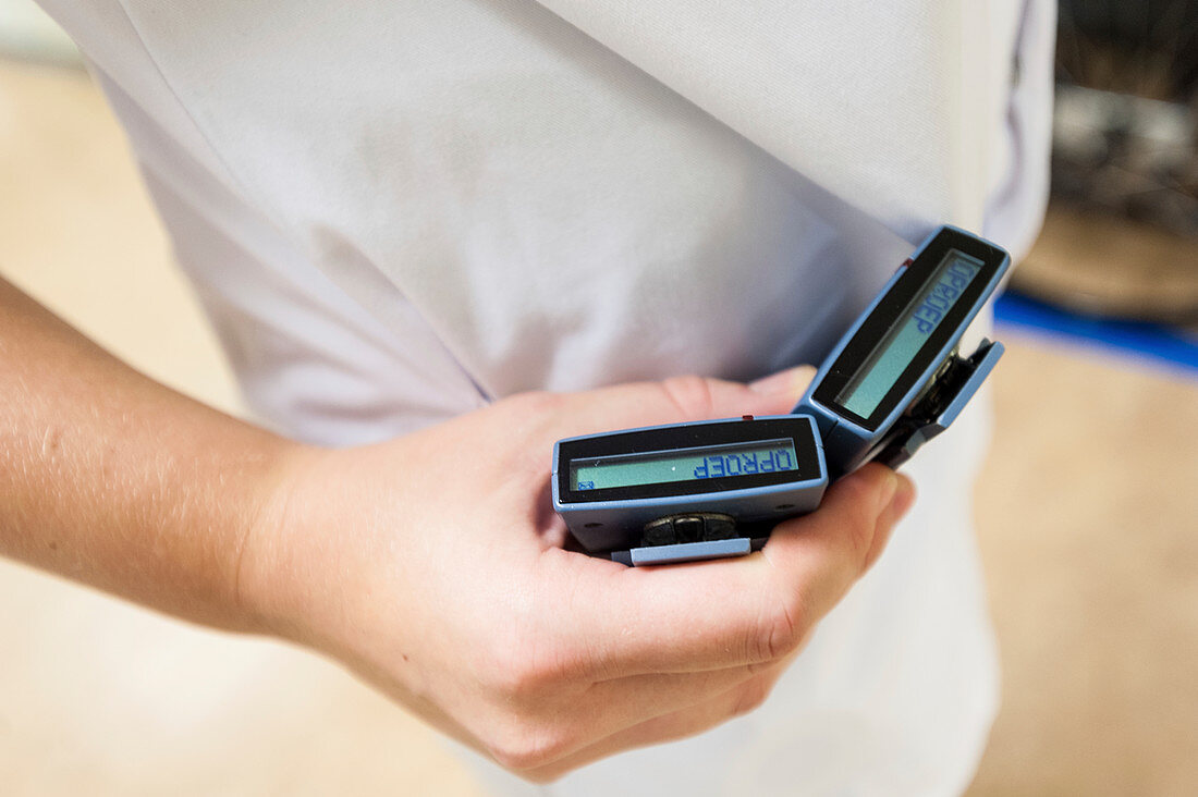Nurse checking pagers