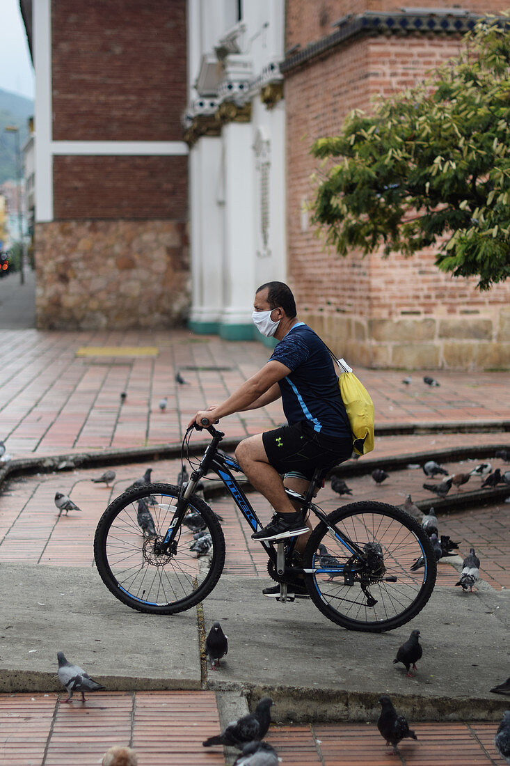 Cyclist wearing face mask