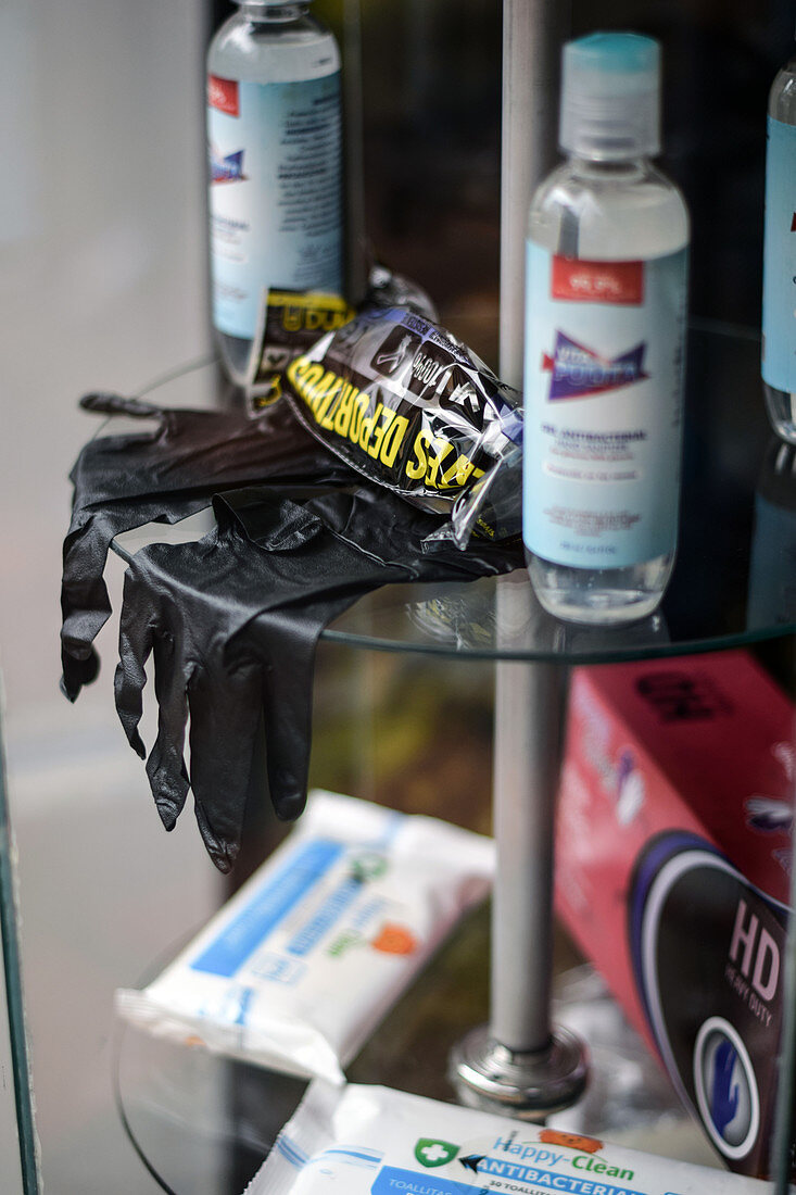 Gloves and disinfectant in shop