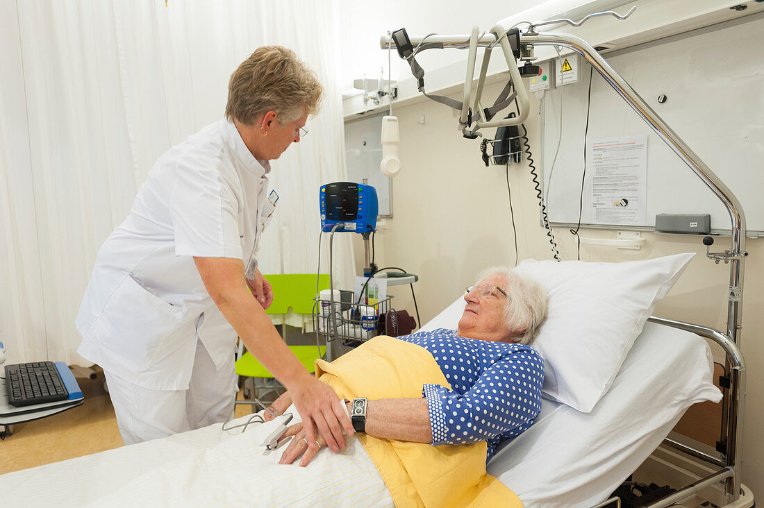Nurse checking on a patient