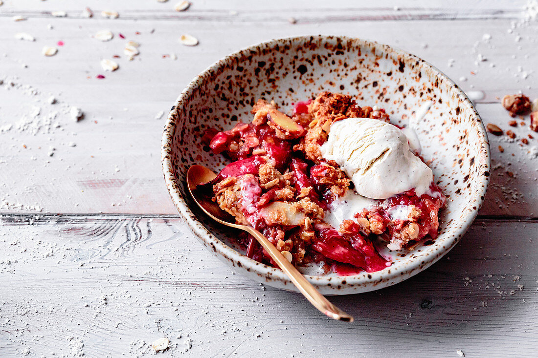 Rhubarb crisp with ice cream in a bowl