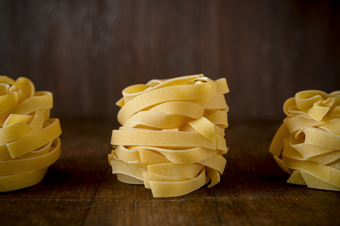 Tagliatelle on a wooden surface